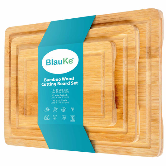 Set of three bamboo cutting boards with juice grooves and handles